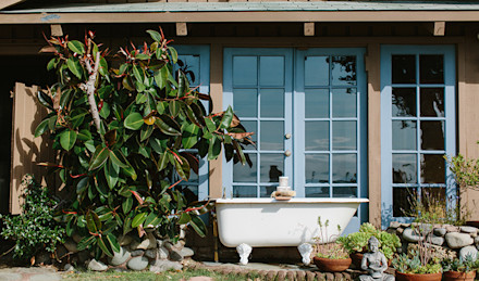 Osea products on a bathtub in an outdoor setting.