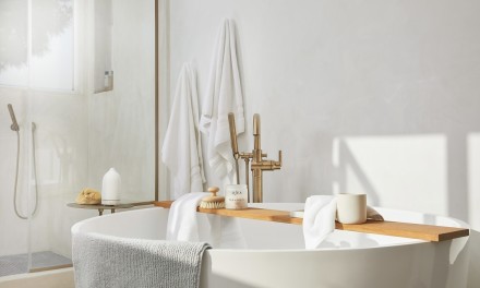  a product shot of our towels hanging in a luxurious bathroom