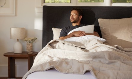 man sitting in bed 