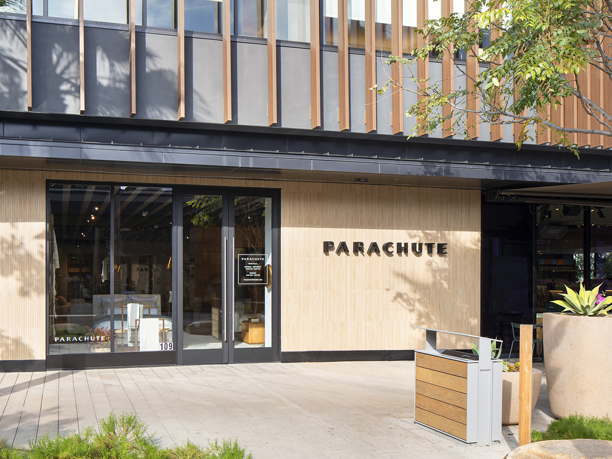 Wood-paneled storefront of the Parachute Sportsmen's Lodge location