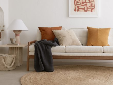 Round Jute Rug Shown In A Room