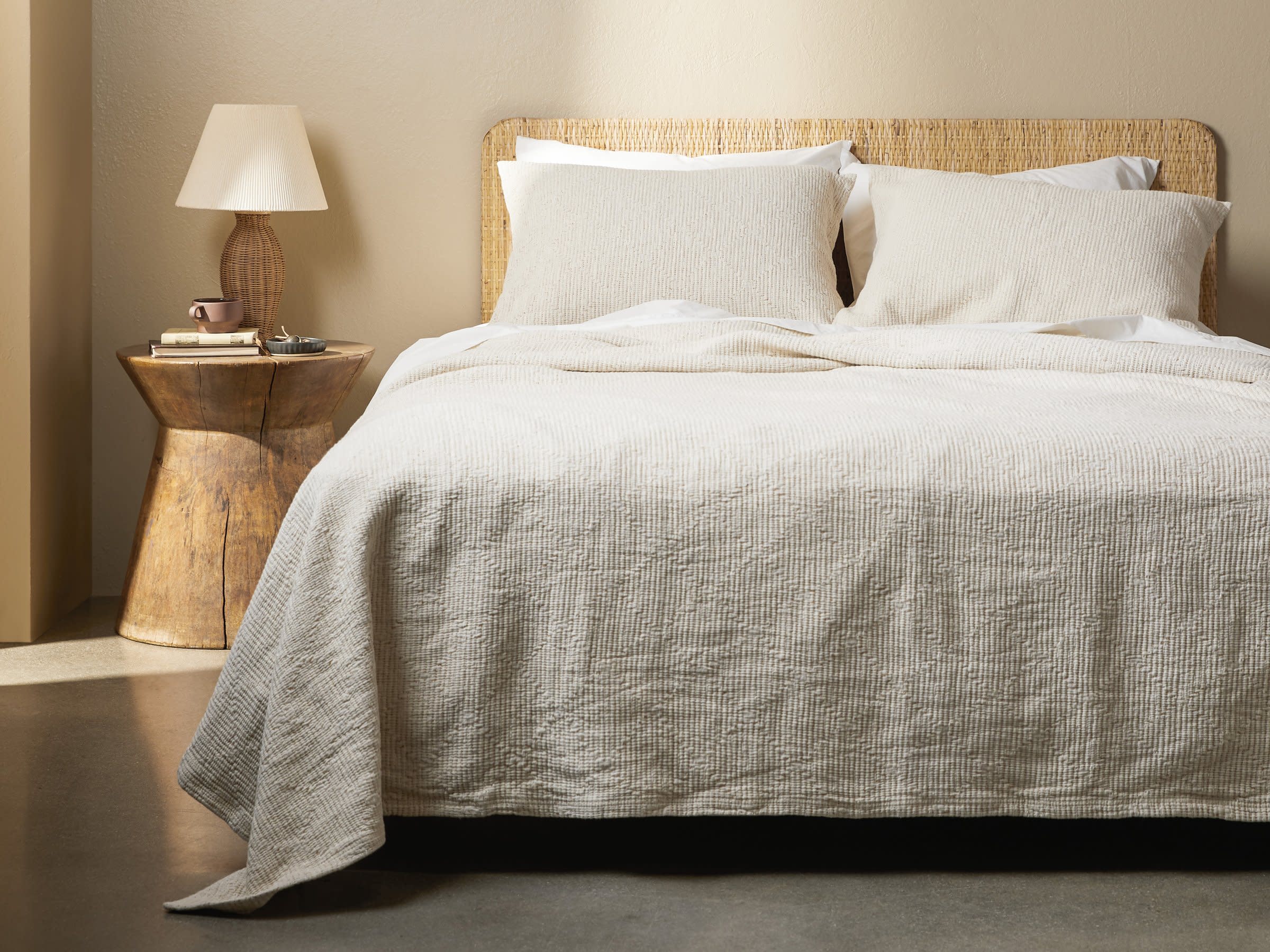 Cream And Ochre Linea Cotton Coverlet Shown In A Room