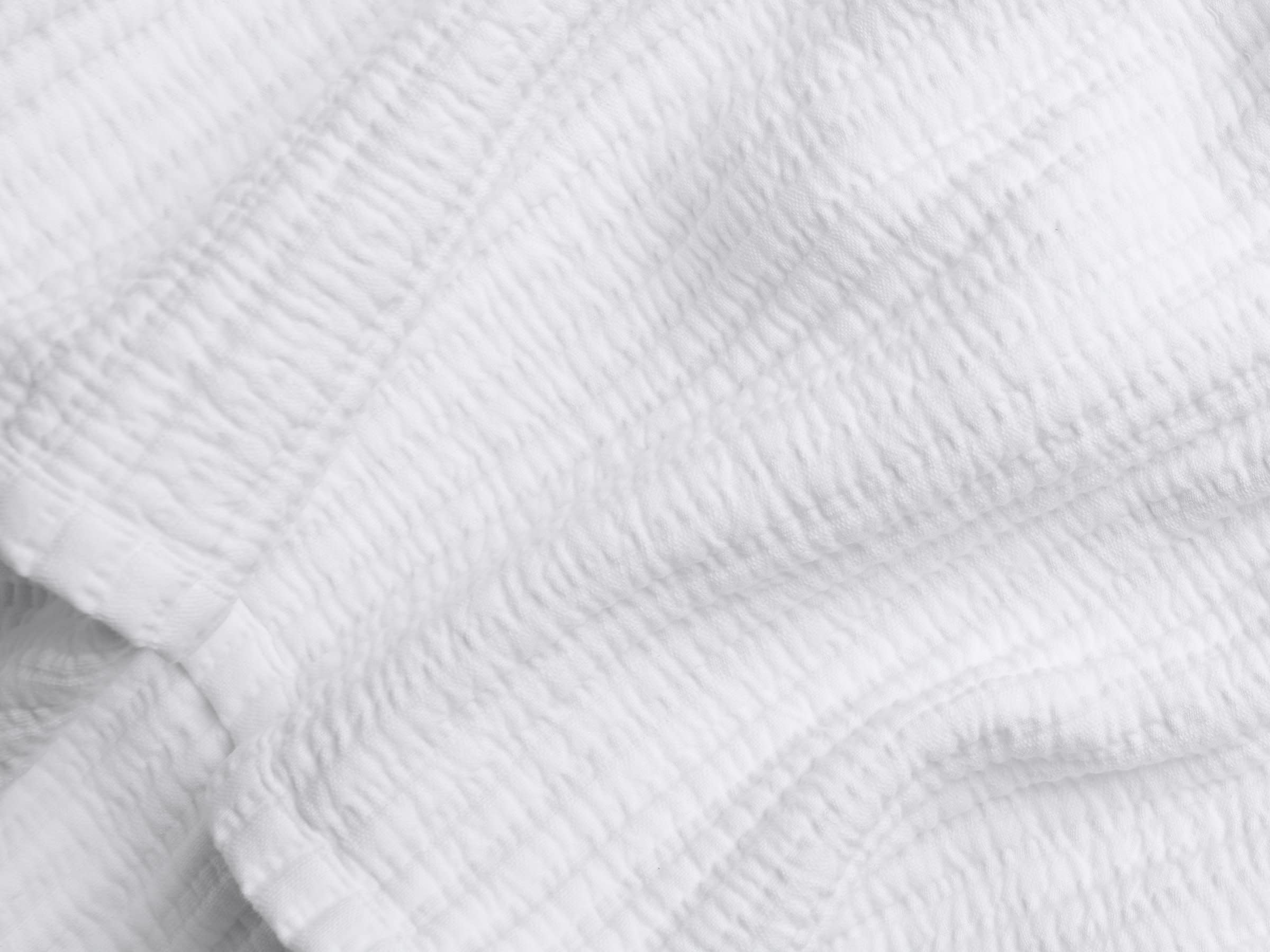 Close Up Of White Matelasse Coverlet
