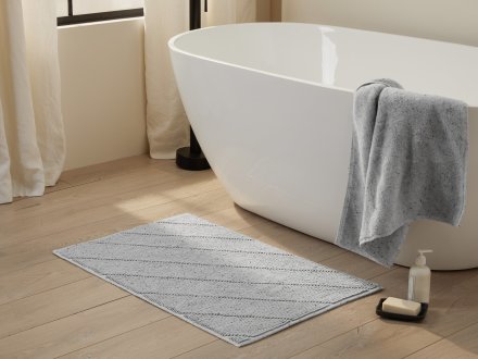 Speckled Bath Rug Shown In A Room