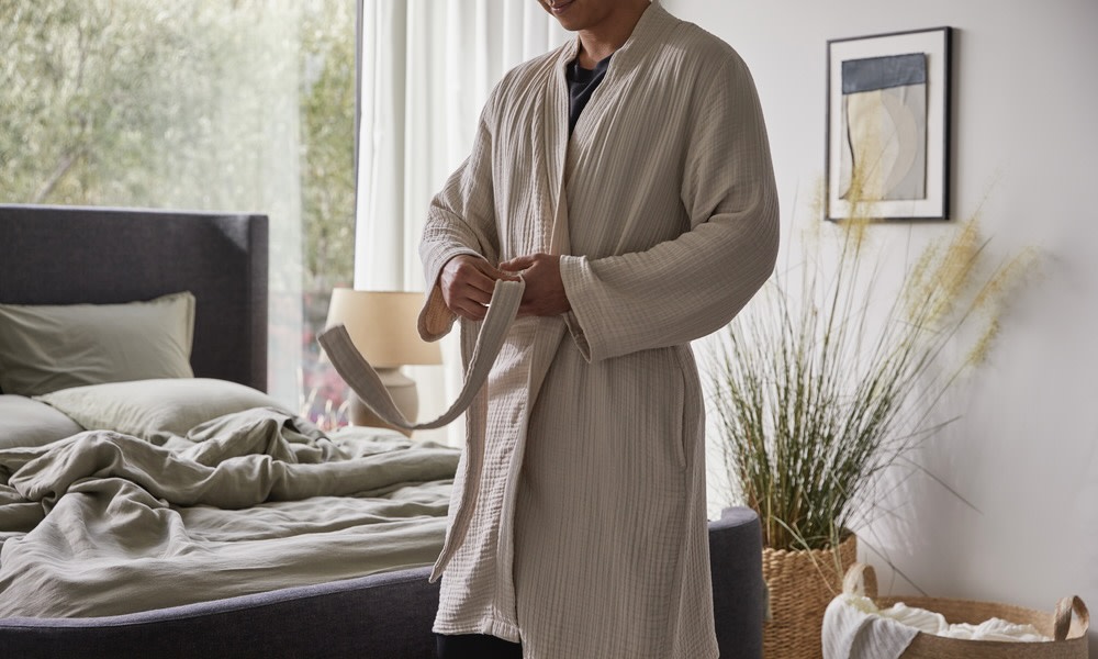 person wearing cloud cotton robe 