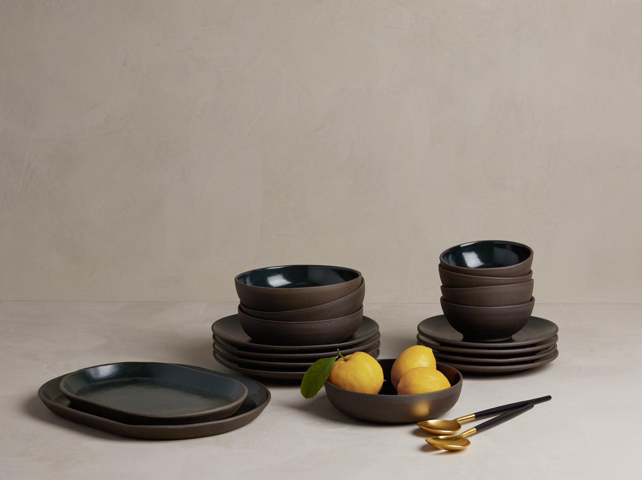 Collection of Coupe Dinnerware and Oval Platters on a dining table.