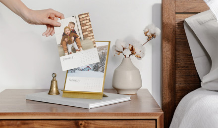 Photo holder on a nightstand. 