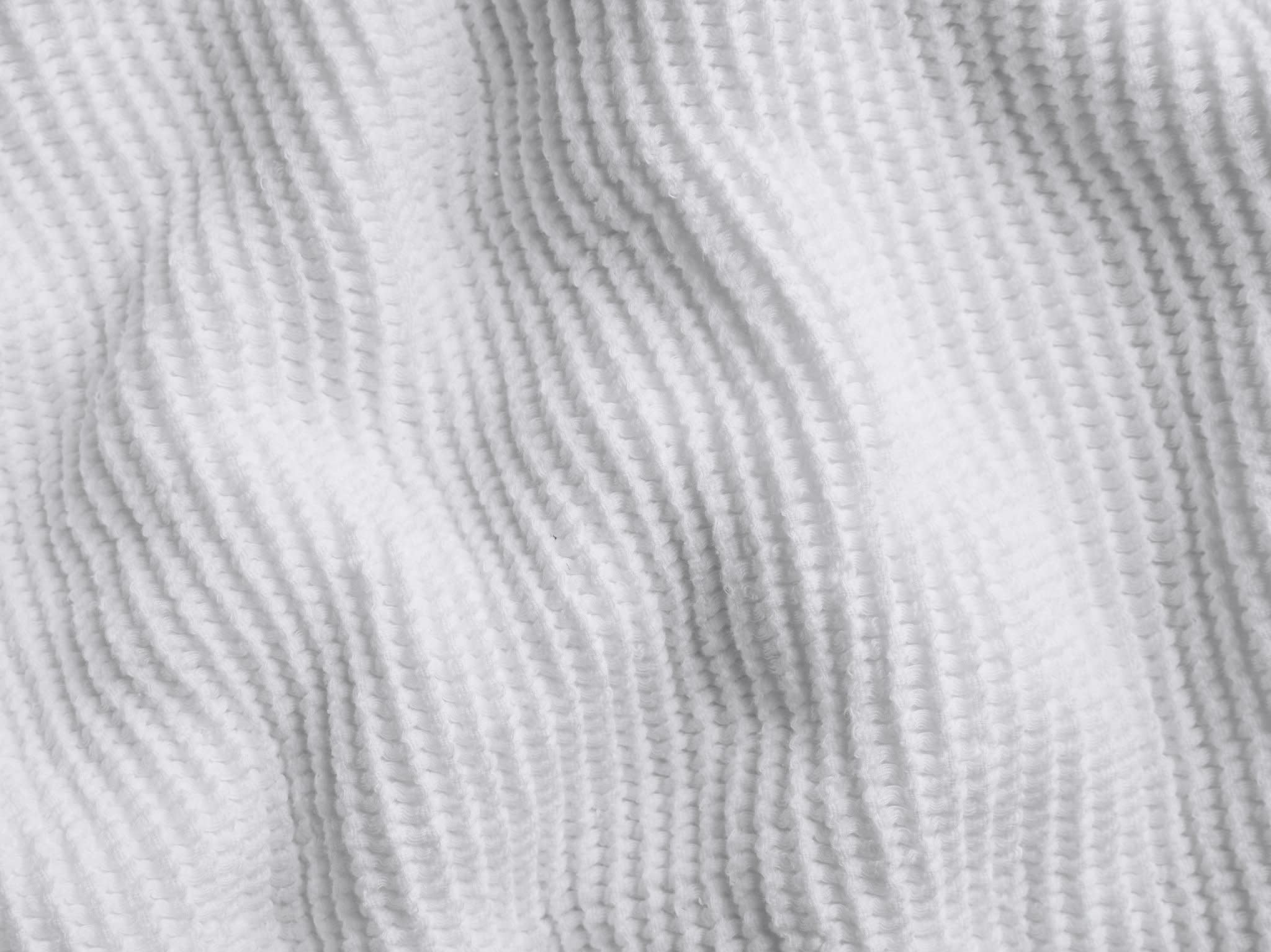 Close Up Of White Waffle Bed Blanket