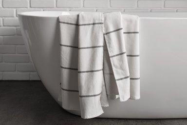 Cream Fouta Stripe Towels Shown In A Room