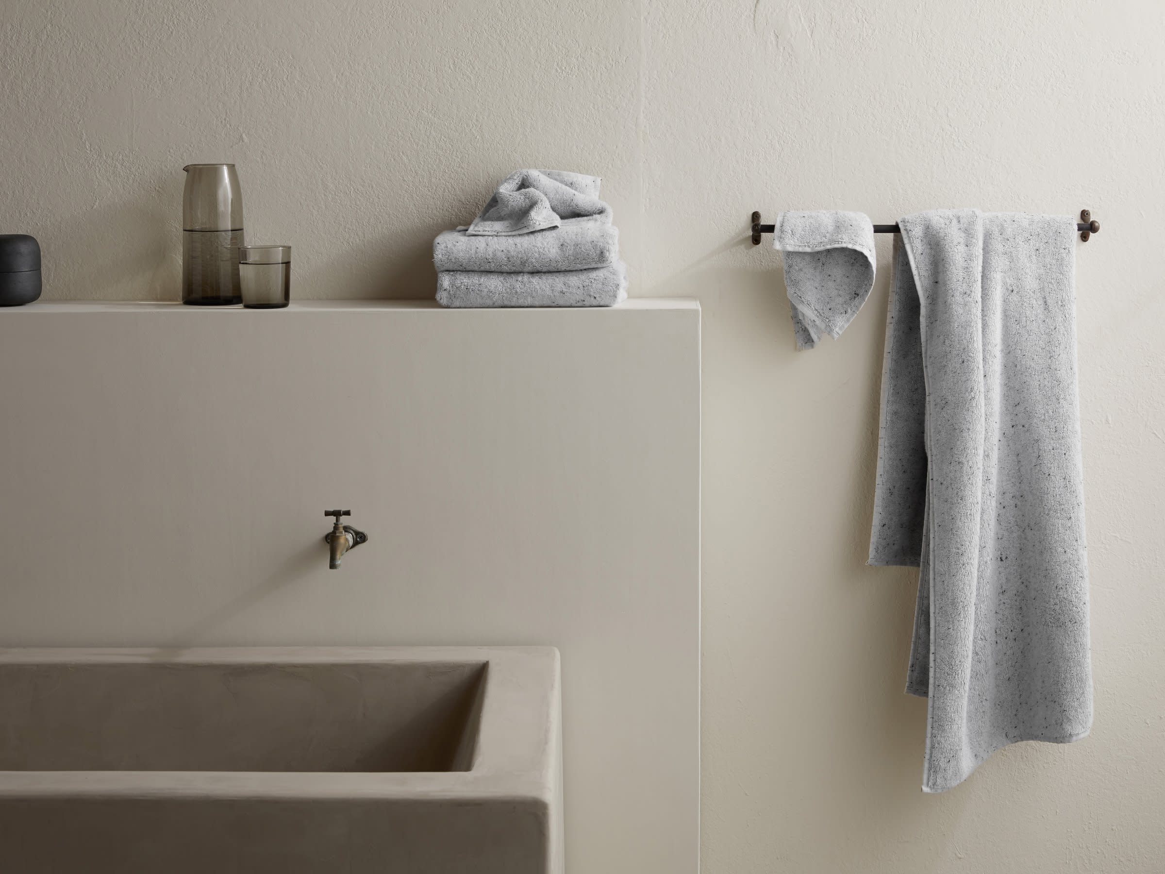 Grey Speckled Towels Shown In A Room
