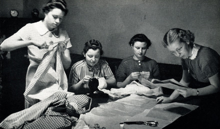 Women creating a quilt. 