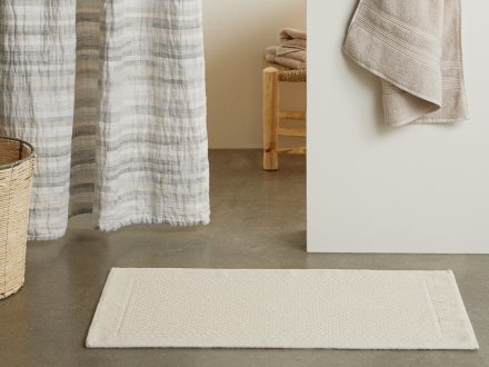 Textured Border Bath Rug Shown In A Room