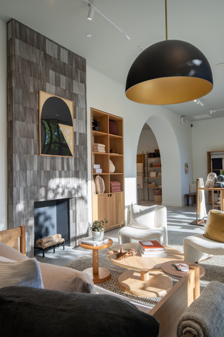 A seating area in our Easton store with a tall fireplace and neutral-toned furniture.