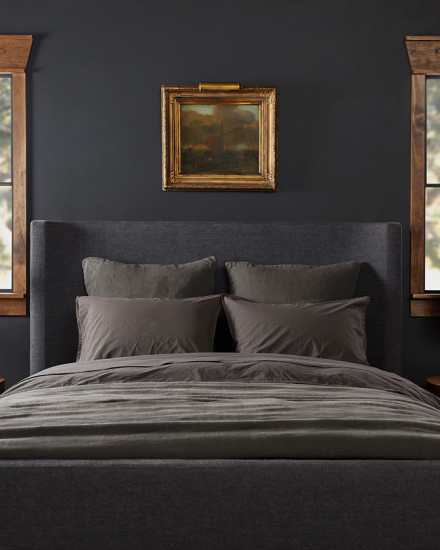 A neat bed with dark grey shale organic cotton sheets