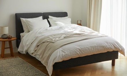 Dune Bed Frame in bedroom with light bedding. 