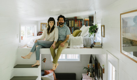 Image of the couple in their bed. 