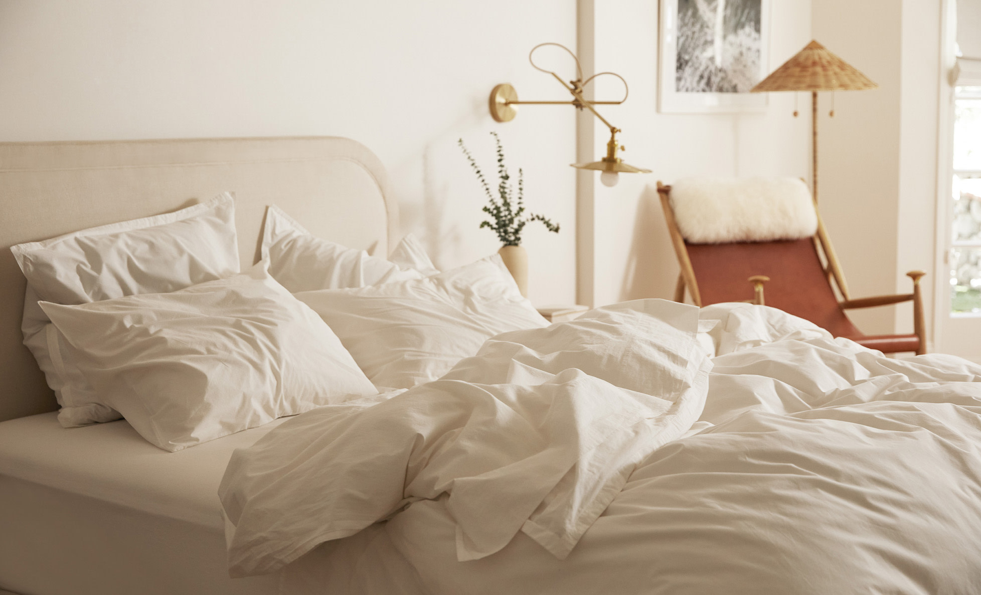 White percale sheets on a messy bed