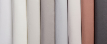 A row of Percale sheets in various colors
