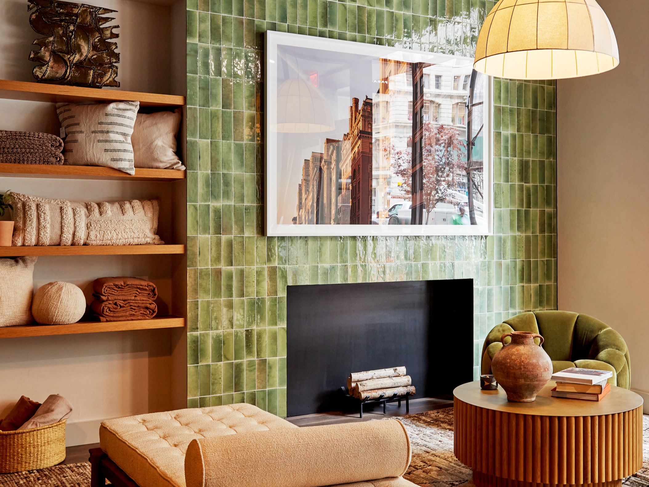 A green-tiled fireplace in a cozy sitting room