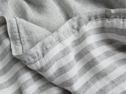 Close Up Of Striped Linen Baby Quilt