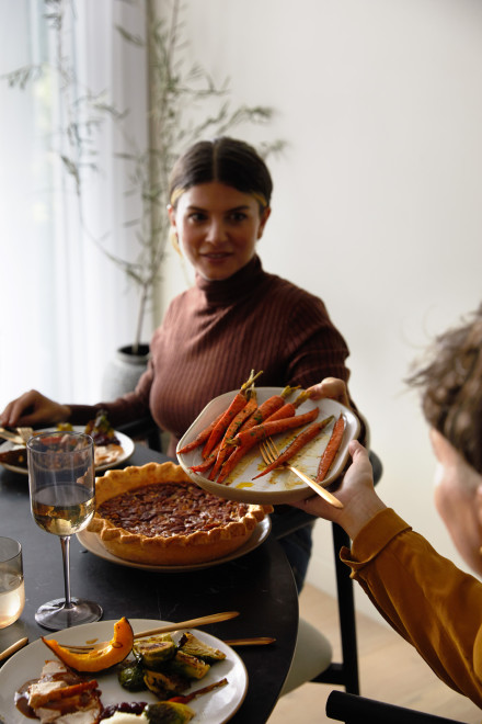 Woman at table with pecan pie