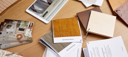 A table scattered with fabric swatches 