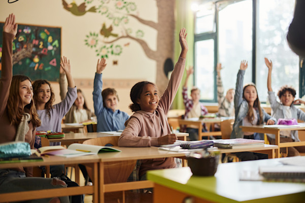 Kids Raising hands in Classroom