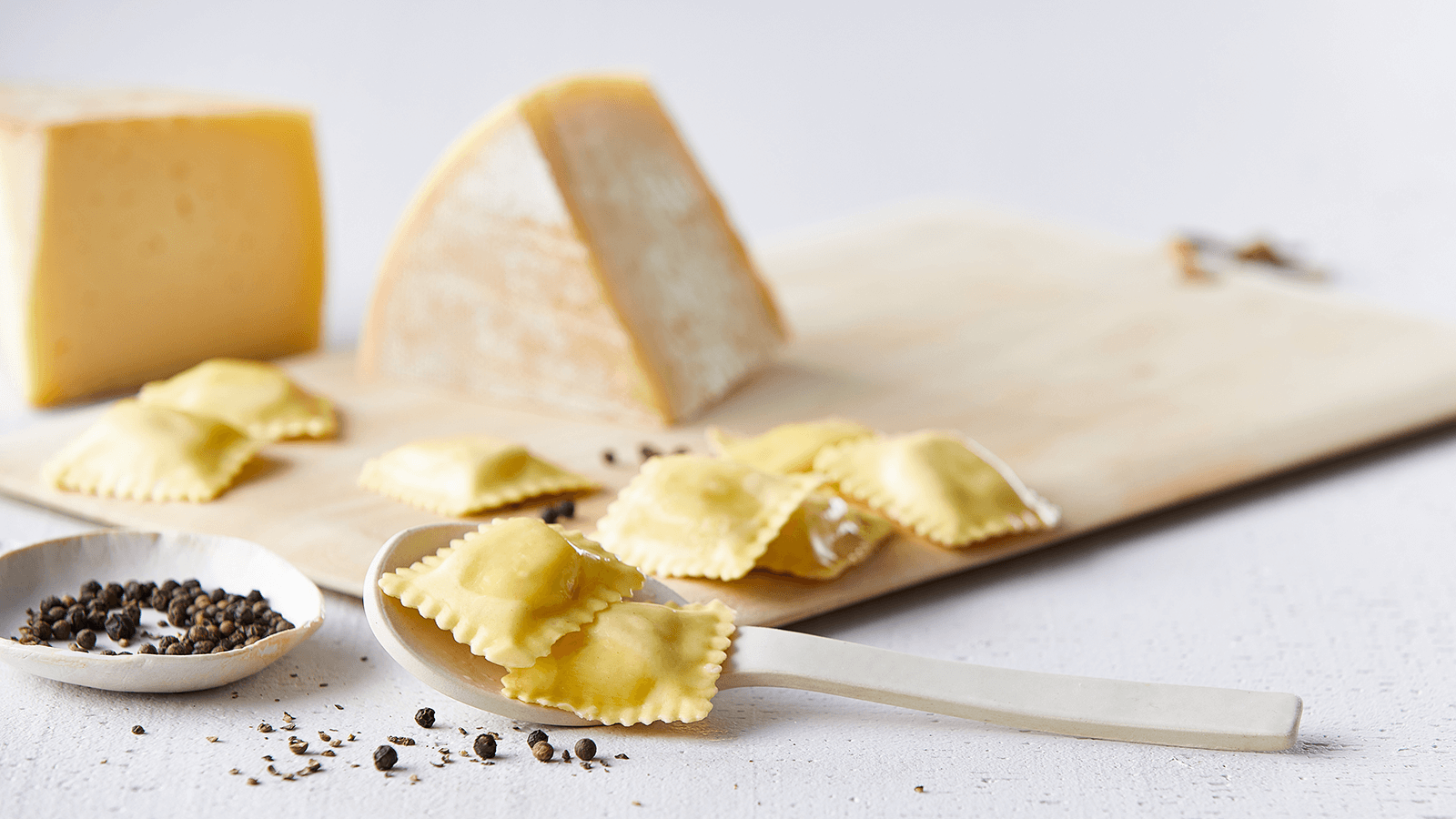 Cacio E Pepe Ravioli with Pancetta and Peas