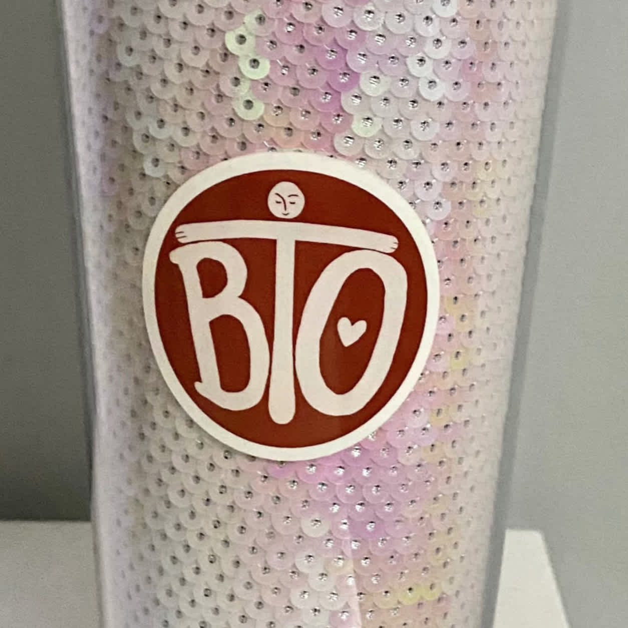 Image of Round sticker item, showing sticker on cup in centre.
