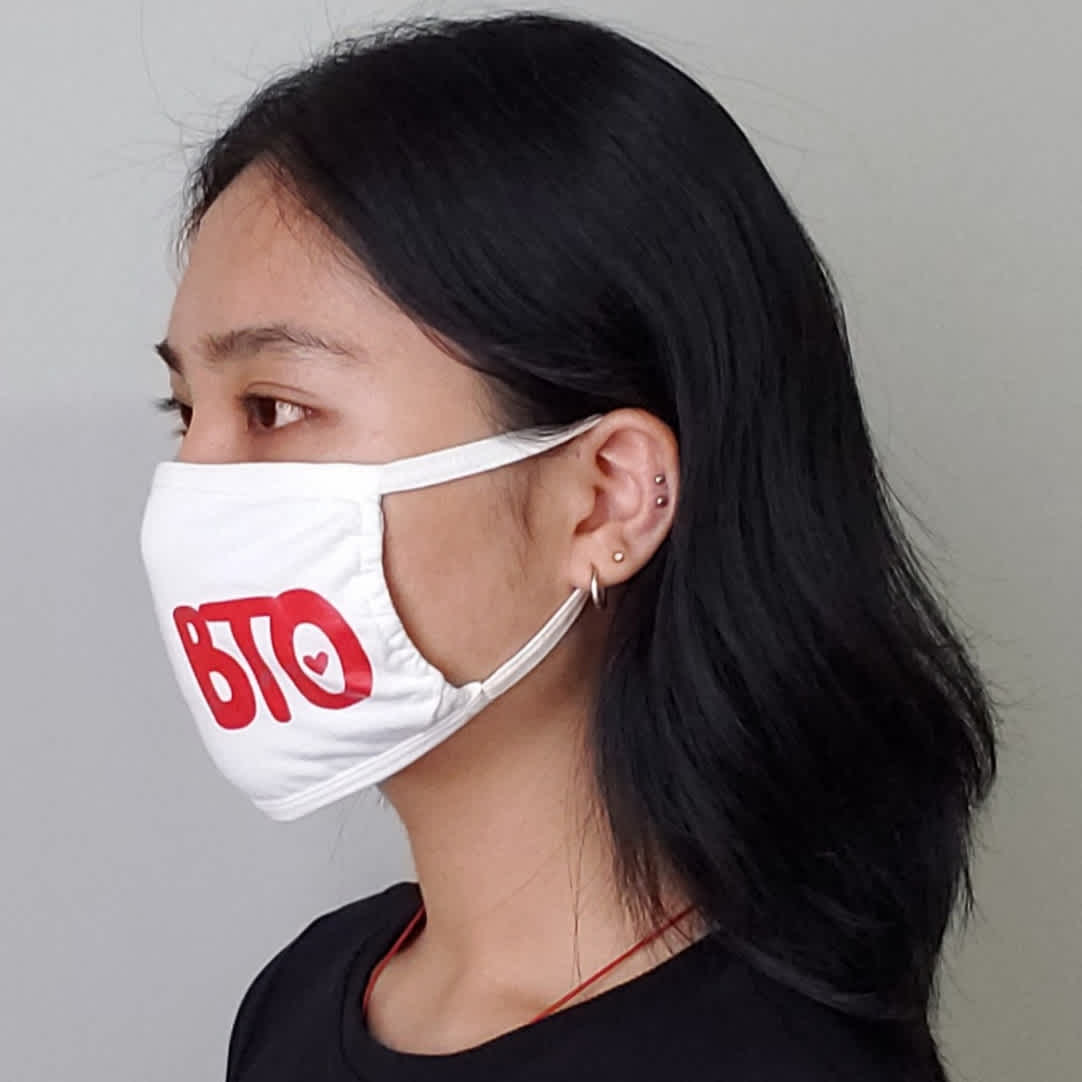 Image of person modelling Mask 3-pack item on the BTO store, showing left side.