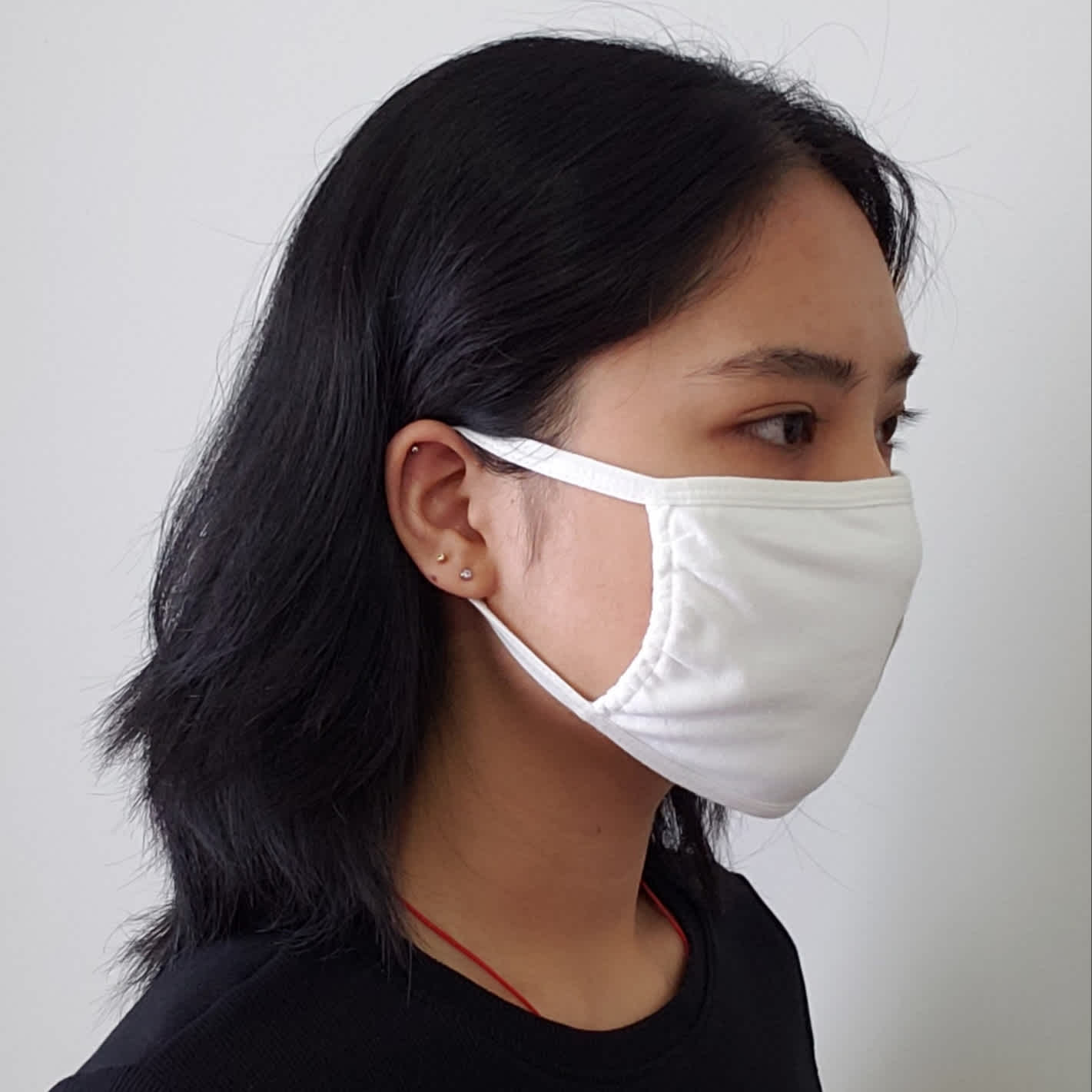 Image of person modelling Mask 3-pack item on the BTO store, showing right side.