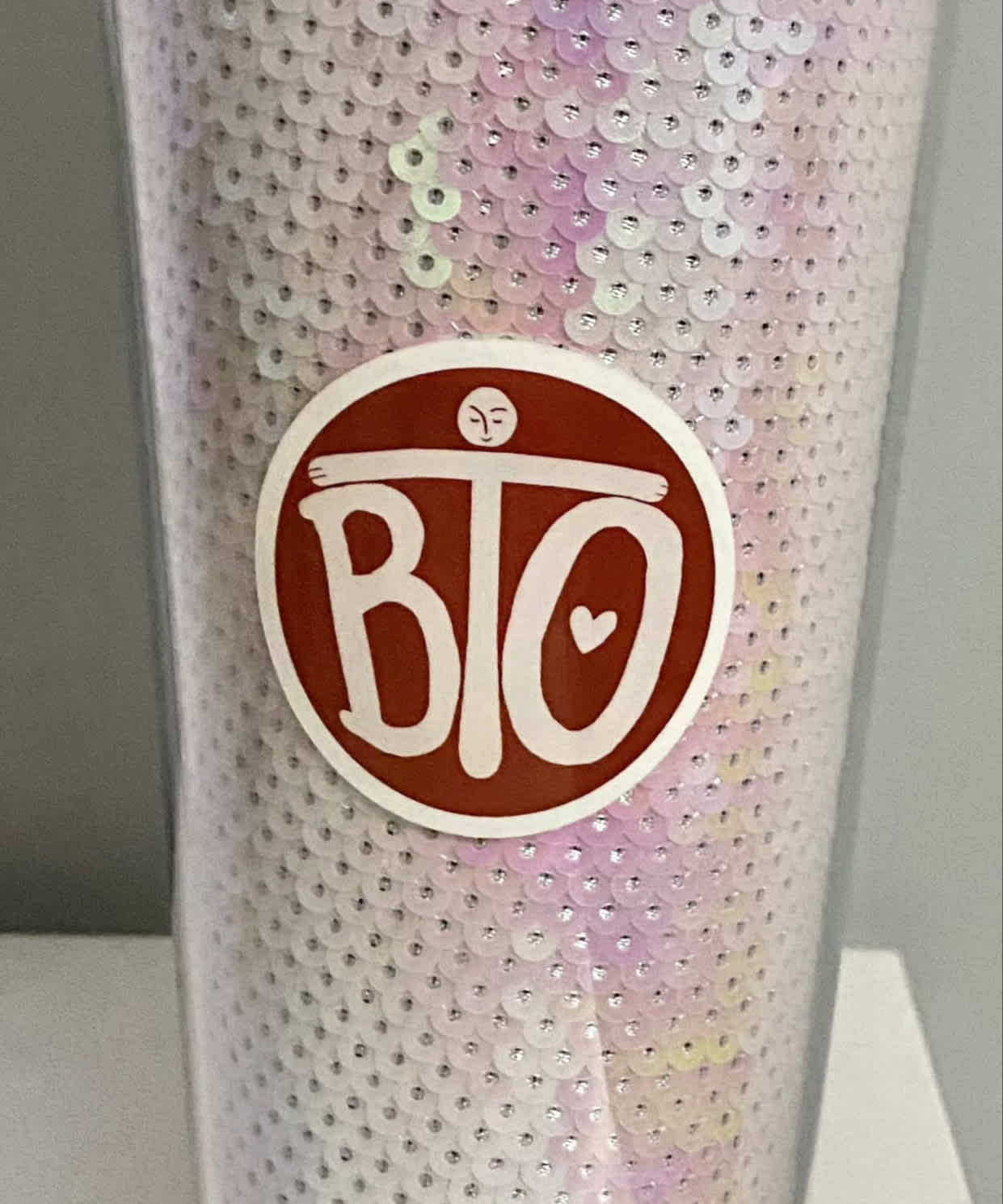 Image of Round sticker item, showing sticker on cup.