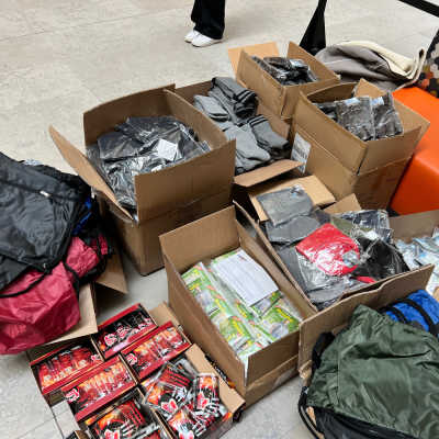 Funds from the January Blanket Drive were used to purchase items seen in this photo, including hats, socks, scarves, bags, and hand and feet warmers.