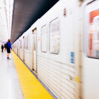 A subway train pulls into Spadina Station in Toronto. Photo by Jed Dala Cruz on Unsplash.