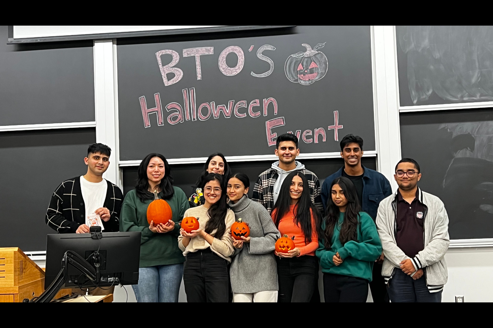 BTO executive team members line up for a group photo after the conclusion of the 2022 Halloween Pumpkin Carving Night.