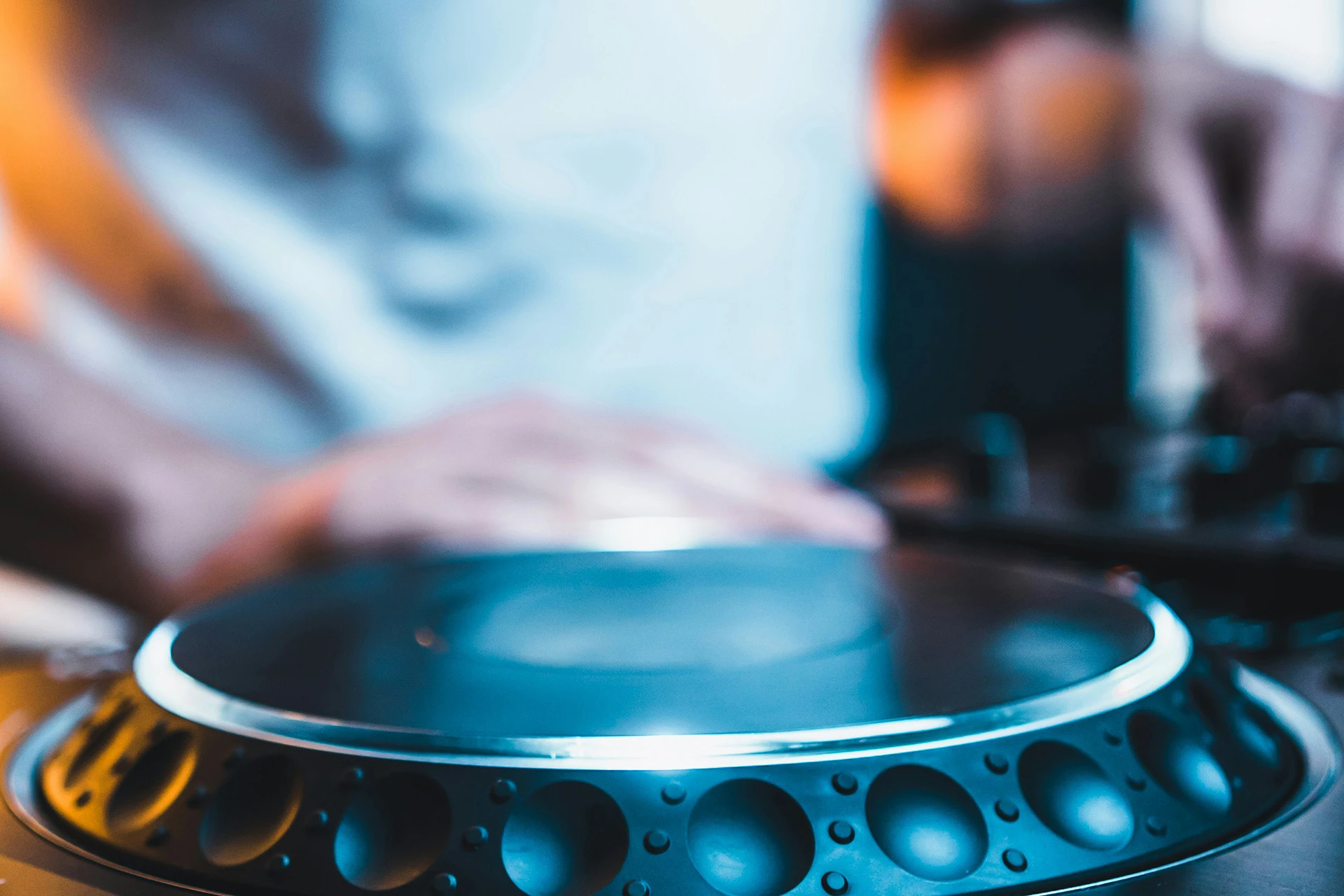 close up shot of person using CDJs