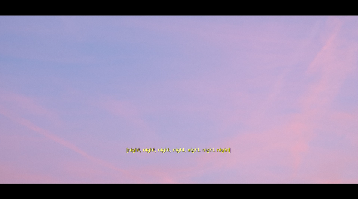 Blue sky with wispy pink clouds, chemtrails. Yellow caption text reads, “night, night, night, night, night, night, night.”