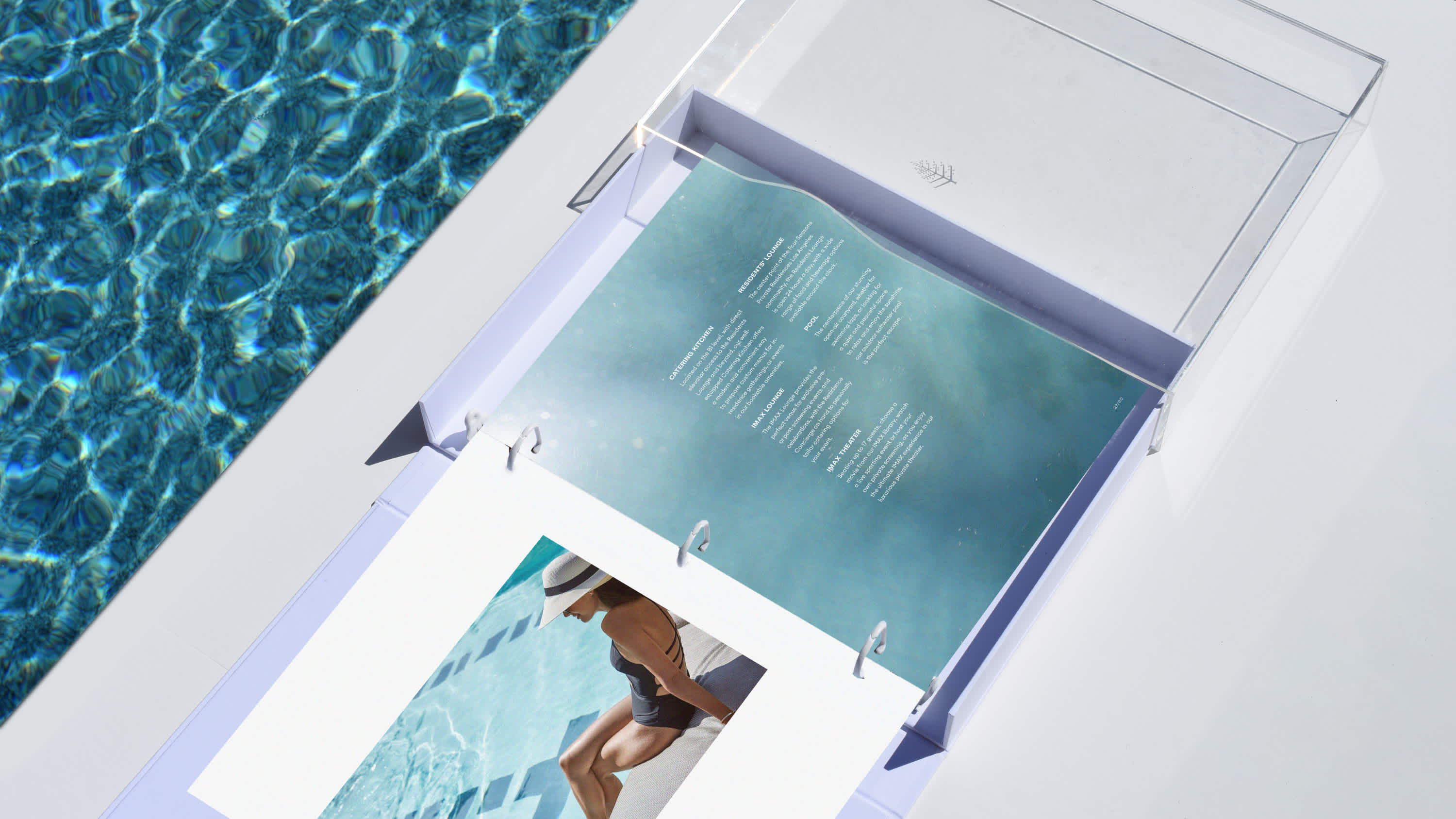 Dive into the essence of the Four Seasons Los Angeles with this visually stunning open compendium by the poolside. The contrast of crisp white pages against the ripple of azure waters captures a serene yet vibrant LA vibe, perfect for those who cherish luxury and relaxation.