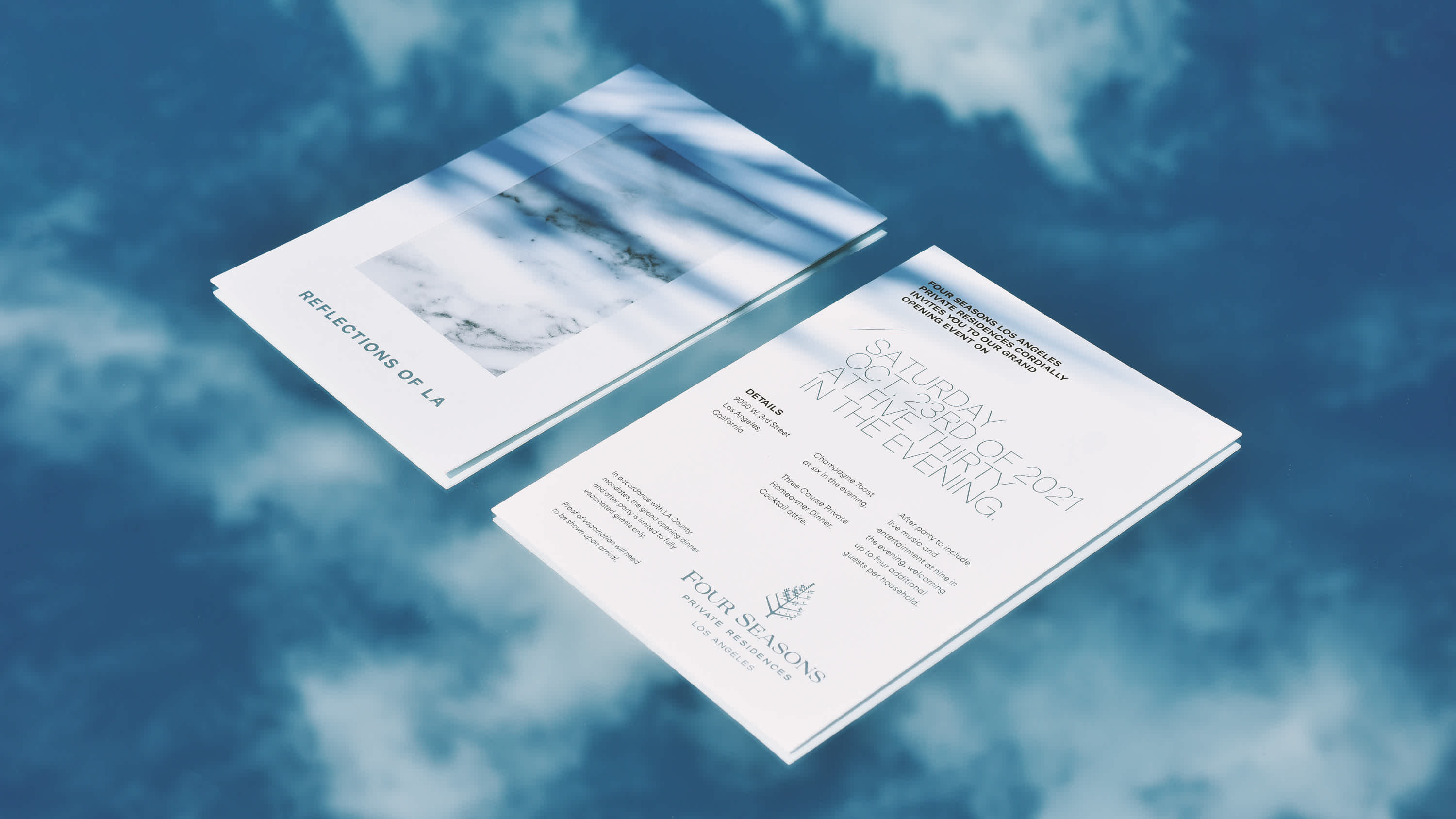 Ascend to the skies with Four Seasons Los Angeles' elegant invitation, floating above a dreamlike reflection of clouds. The marble detailing on the cover marries with the ethereal backdrop, offering a taste of the exclusive events that define the LA luxury lifestyle at its finest.