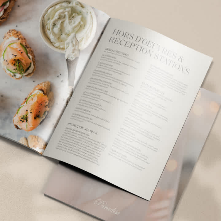 A booklet for Paradise Banquet Halls opened to the interior pages showing photography on the left and a menu on the right with a Hors D'oeuvres heading and menu items listed below to order for a wedding, event or anything in between. 