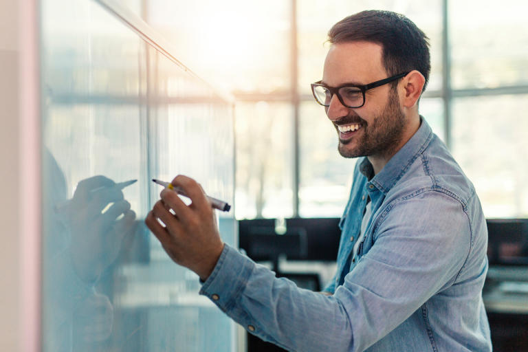 A business owner discussing in a meeting how lease-to-own can help refresh their retail business model.