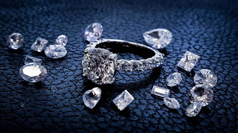 A diamond ring surrounded by diamonds of varying shapes