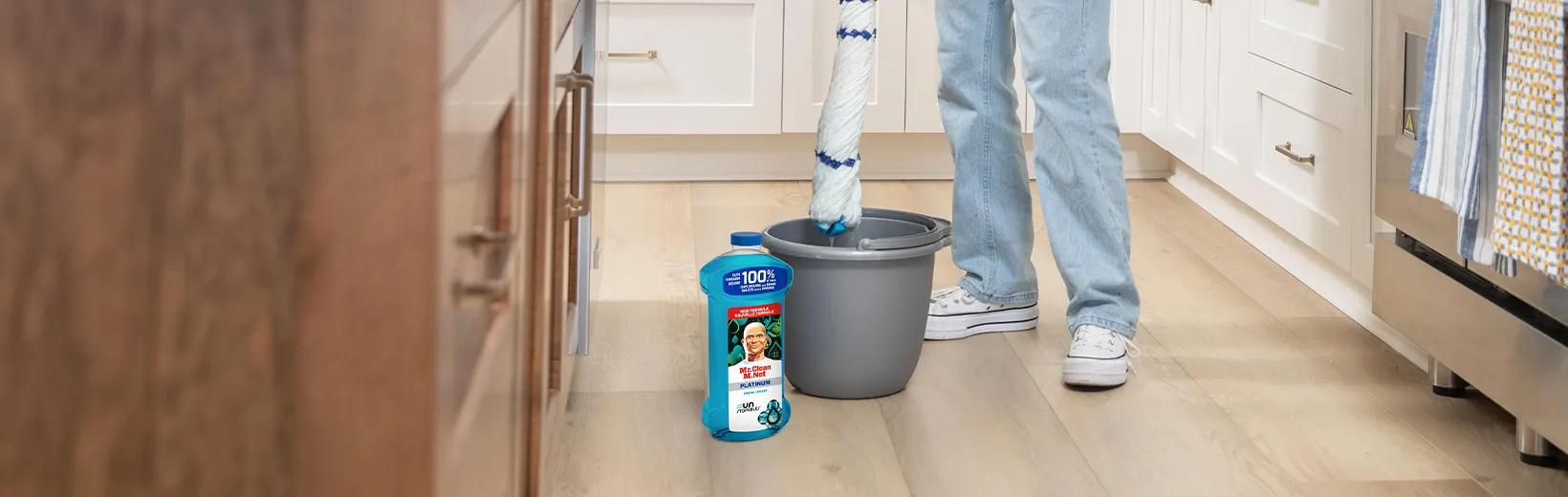 Cleaning laminate floors with a mop and Multi-Surface Cleaner Unstopables Fresh