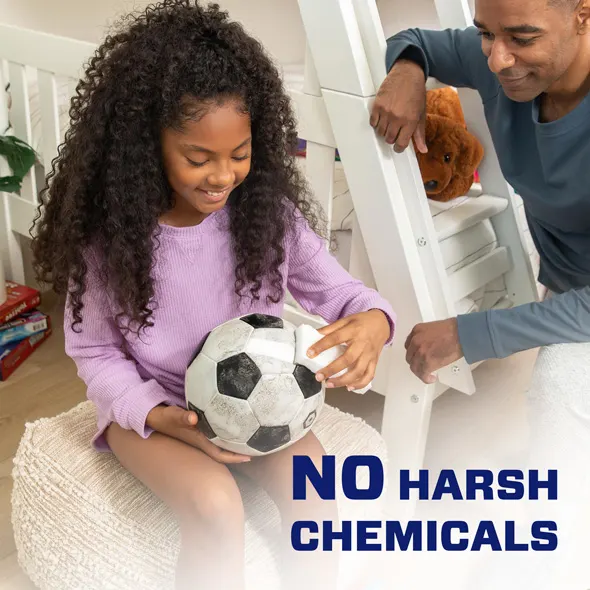 A man and a girl cleaning sneakers together, promoting Mr. Clean Magic Eraser using just water