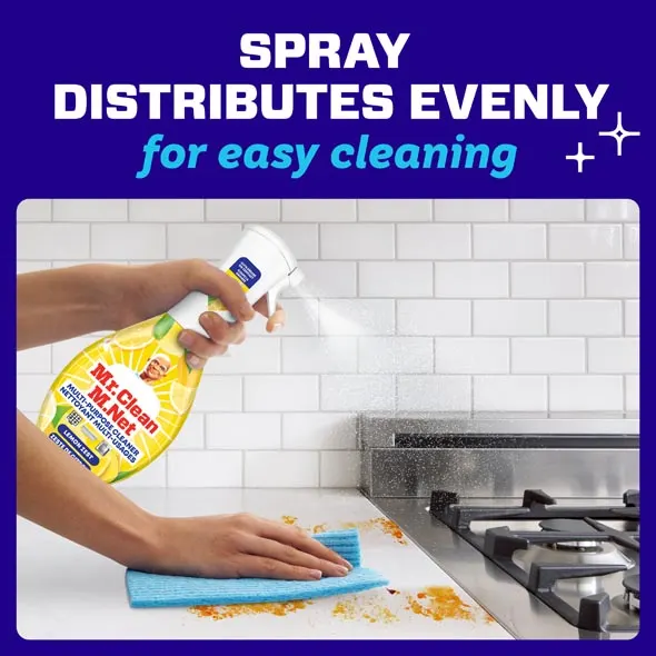 Hand holding spray bottle cleaning kitchen surface, demonstrating effective multi-purpose cleaning action