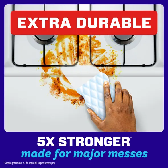 Cleaning a kitchen stove with a Magic Eraser, showcasing its strength against tough stains and messes
