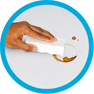 Cleaning coffee rings of a countertop with Mr. Clean MagicEraser