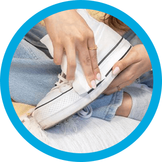 Mr. Clean wipe cleaning dirty shoes