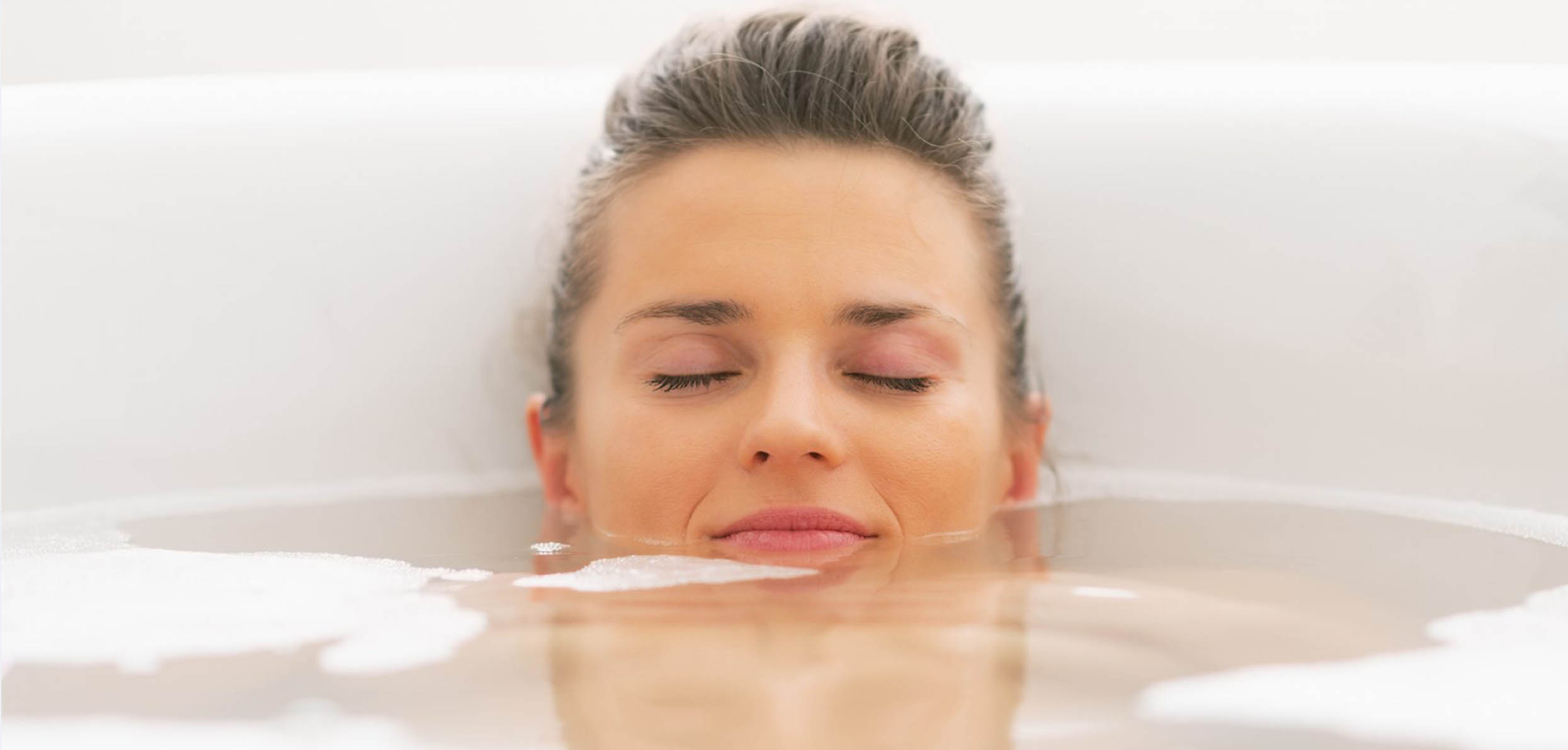 woman relaxing on the tub - triggers for hot flashes