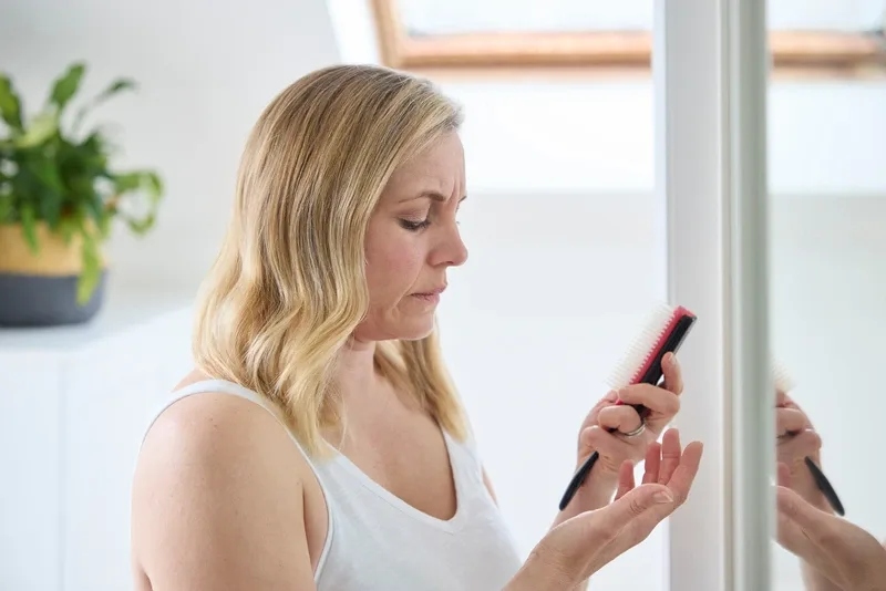 Hair looking at hair brush 